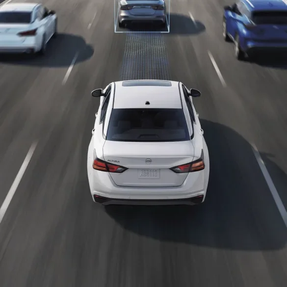 2027 Nissan Altima on freeway surrounded by cars with schematic drawings of ProPILOT Assist capabilities at MATZ Nissan in Troy AL